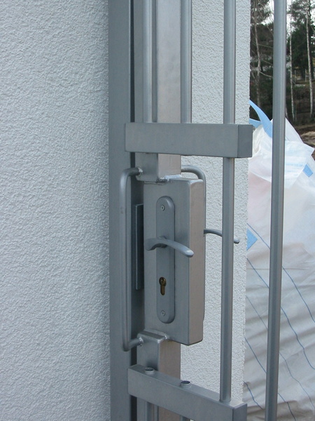 Gate to the tubular fence