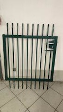 Gate to the tubular fence